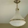 Wesley 15 Pendant shown from side angle mounted on ceiling in beige room