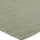 Close-up of textured sisal herringbone weave with visible fiber detail and edges