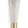Close-up of white marble lamp body tapering to brass ring midsection