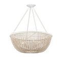 Diagonal view of beads and twine wrapping with softly diffused warm light glowing through chandelier