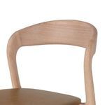Close-up of Amare Stool's smooth curved wood backrest