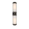 Sconce lit from front showing bronze frame with exposed screws and glowing white glass tubes