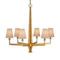 Goldfinch chandelier with eight white fabric shades, softly glowing on white backdrop