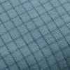 Close-up of ocean blue pillow fabric highlighting subtle grid texture and weave
