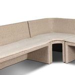 Close-up showing backrest and seat cushions with fabric cover and subtle button tufting