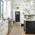 Long runner version of Margot Ocean Spice rug in kitchen with black island and white cabinetry