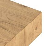 Close-up of edge detail showing corner and wood grain at top meeting fluted circular column