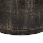 Close-up detail of the base plinth showing distressed bronze finish with varied patina