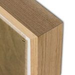 Corner detail of smooth light vertical grain white oak frame with white matte border