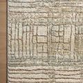 Corner of Wyatt Lagoon Natural Rug on wooden floor highlighting plush texture and detailed pattern.
