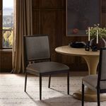 Glenview Dining Chair styled in a dining room with round wood table and decorative candles