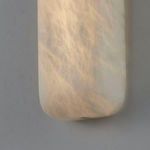 Close-up of illuminated alabaster texture with warm light casting soft shadows