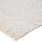 Close-up corner view of the Torre rug highlighting plush texture and fringe detail