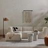 Side view of Sante End Table highlighting thick cylindrical legs and round tabletop edge