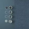 Close-up showing Rustic Weft Wallpaper texture contrasted with solid blue paint and coordinating paint sample pots.