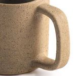 Close-up of square-shaped handle showing texture and attachment to mug body