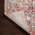 Corner flipped to show woven backing and tightly bound edges of Cassandra Rust Ivory Rug