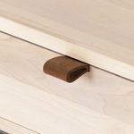 Close-up of smooth, light, natural wood surface on console table top