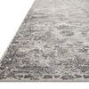 Side angle showing rug’s low pile height and subtle texture with tightly finished edge