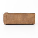 Back view of sofa with uniform natural washed sand leather and subtle wood legs