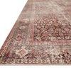 Close-up corner view highlighting the vintage distressed pattern and layered colors on the rug