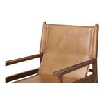 Close-up of Remy Dining Chair leather and wood armrest details with visible stitching.