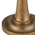Repeat close-up of textured round brass base showing concentric circle layers