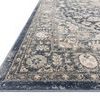 Close-up angled view of Teagan Denim / Mist Rug showing soft pile texture and detailed border