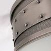 Angled close-up highlighting rivet placement over textured steel and frosted diffuser below