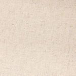 Angled close-up on ottoman and adjacent seat cushions showing slipcover fit