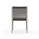 Back view tilted slightly showing rope weave and chair legs in soft shadows
