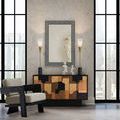 Pair of Martini Black Torchiere Table Lamps flanking black and wood cabinet under large black-framed mirror