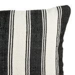 Corner close-up showing pillow edge and striped fabric detail