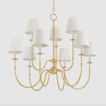 Side angle of Amina Chandelier highlighting curved J-arms and detailed brass finish