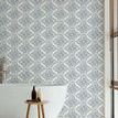 Timbre Damask wallpaper applied on bathroom wall behind freestanding tub, natural light from wooden blinds