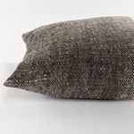 Close-up on dark charcoal woven fabric side with visible flax fibers and yarn-dyed texture