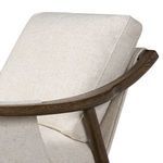 View of back cushion resting against curved oak frame and sling fabric