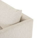 Close-up of back pillow resting against armrest with visible fabric weave