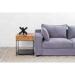 Joliet Side Table positioned beside a gray fabric sofa on a patterned rug
