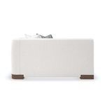 Alternate side view of modular sectional showing clean arm curves and low profile wood feet