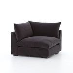 Close-up of armrest seam and cushion join on deep charcoal sectional corner piece