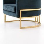 Back view of Corbin Chair showing vertical brass support bars within circular base frame