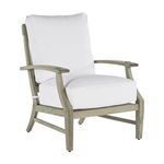 Side angle showing chair armrest and tapered legs with protective caps