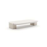 Rectangular cocktail table with a smooth white top and unfilled beige travertine stone block legs