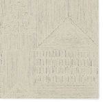 Detail view highlighting intricate geometric and linear pattern in cream and light gray