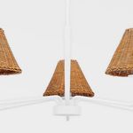 Overhead view of white chandelier arms holding three rattan lamp shades