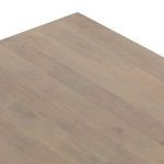 Angular close-up of cane drawers with pronounced wood grain around frame