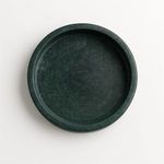 Top-down view showing circular ridges inside the green marble tray