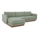 Vernon sectional angled view showing curved armrest and low-profile wooden base