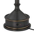 Close-up of lamp base with illuminated red light on power button